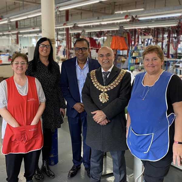 Sewing Skills Workshop team with the Mayor of Bolton on the factory floor at Kearsley Mill