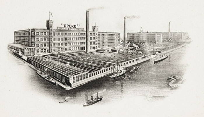 Engraving of the Spero mills of Richard Haworth and Co, with chimneys, warehouses and ships alongside